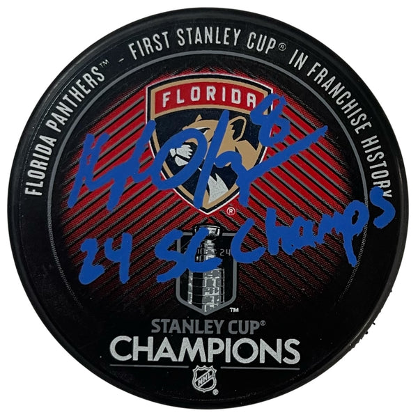 Kyle Okposo Autographed "24 Stanley Cup Champions" Stanley Cup Panthers Puck (Beckett Witness)